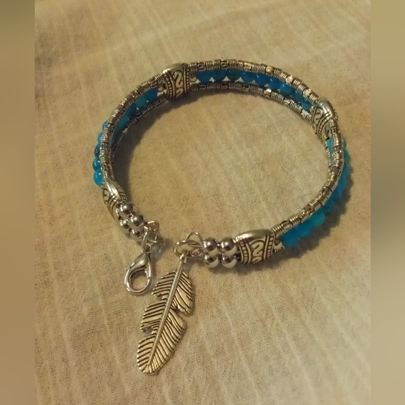 Silver and Blue Rice Bead Bracelet with Feather Charm - Picture 4 of 4